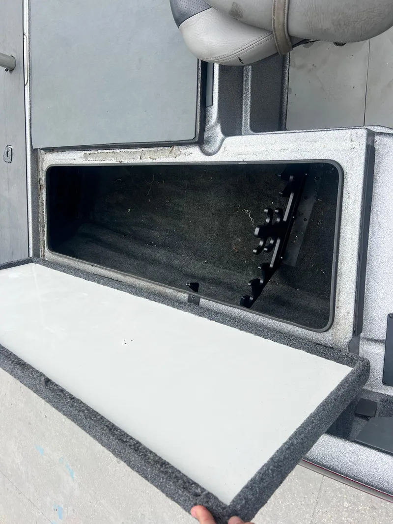 Slide: The Image of Open storage compartment in 2009 Ranger 208 VX boat. - 13