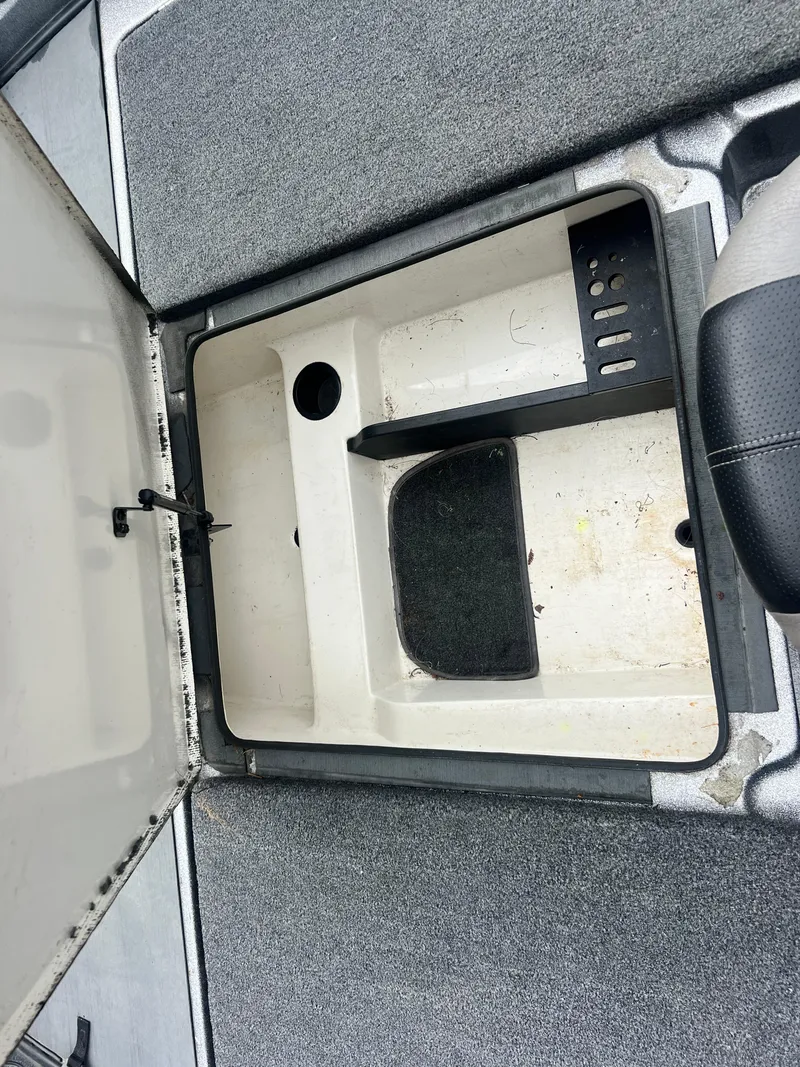 Slide: The Image of Open storage compartment in 2009 Ranger 208 VX boat. - 14