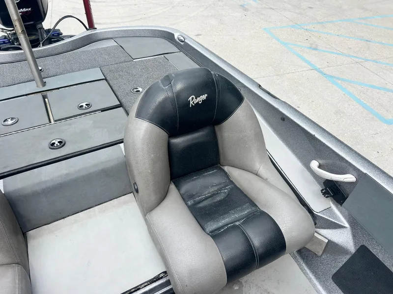 Slide: The Image of 2009 Ranger 208 VX boat seat, gray and black design, on deck. - 16