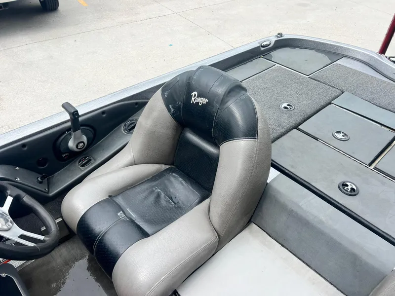 Slide: The Image of 2009 Ranger 208 VX boat interior with steering wheel and cushioned seat. - 17