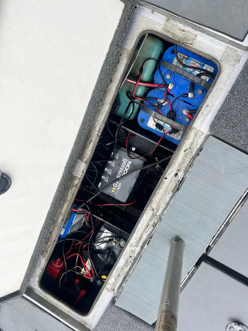 Slide: The Image of Battery compartment of 2009 Ranger 208 VX boat with wiring and components. - 25