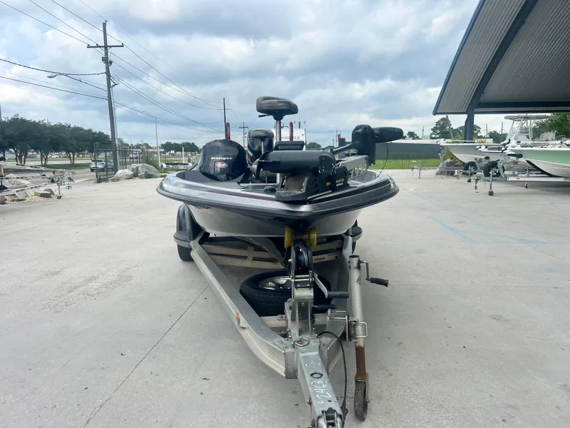 Slide: The Image of 2009 Ranger 208 VX boat on trailer under cloudy sky. - 3