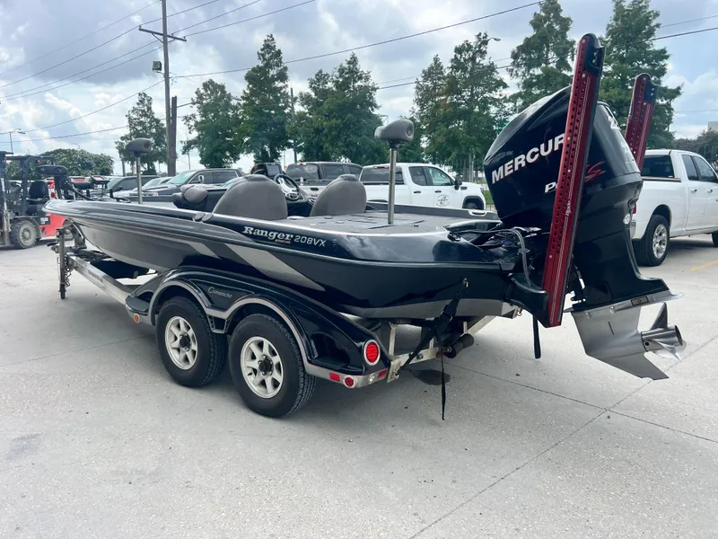 Slide: The Image of 2009 Ranger 208 VX boat with Mercury engine on trailer in parking lot. - 6