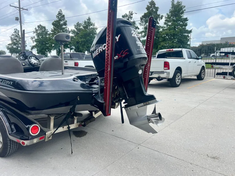 Slide: The Image of 2009 Ranger 208 VX boat with Mercury outboard motor in parking lot. - 7