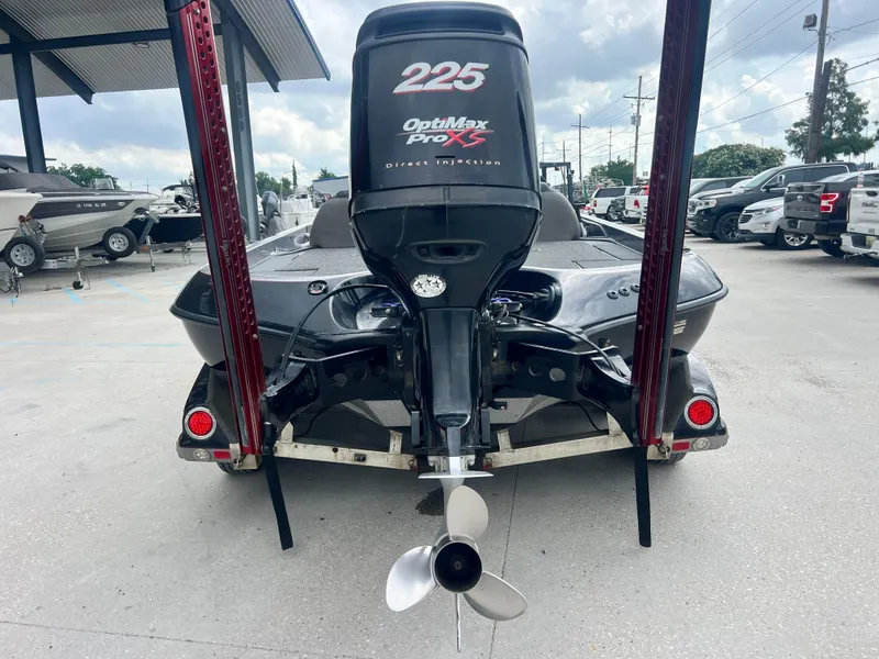 Slide: The Image of 2009 Ranger 208 VX boat with OptiMax Pro XS 225 engine, parked outdoors. - 8