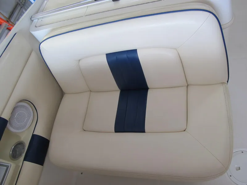 Slide: The Image of 2003 Chris-Craft Launch 28 boat seat with white and blue upholstery. - 11