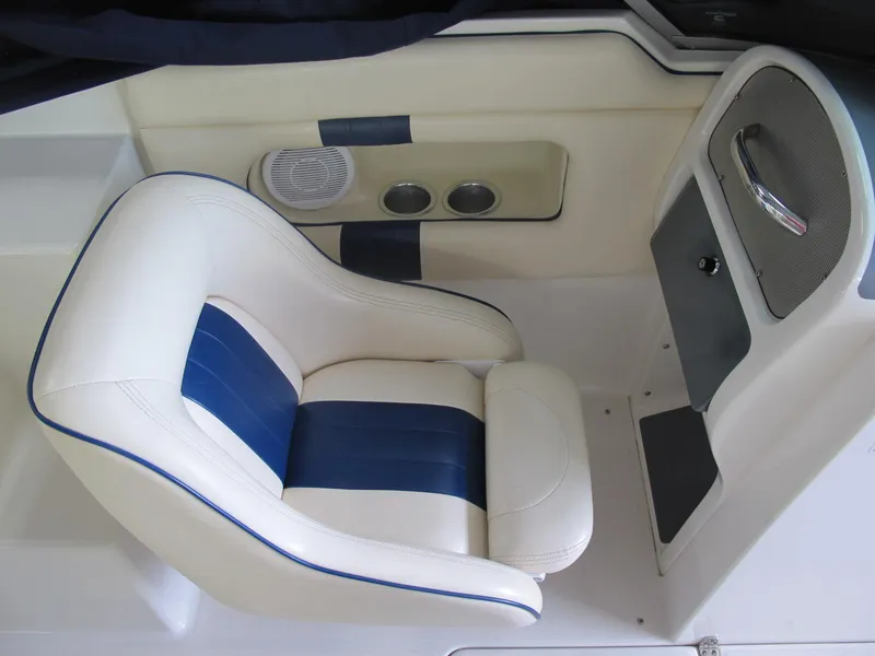 Slide: The Image of 2003 Chris-Craft Launch 28 boat interior with white and blue seating. - 12