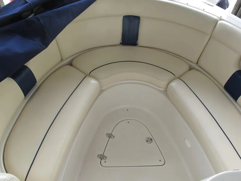 Slide: The Image of 2003 Chris-Craft Launch 28 boat interior with beige seating and blue accents. - 5