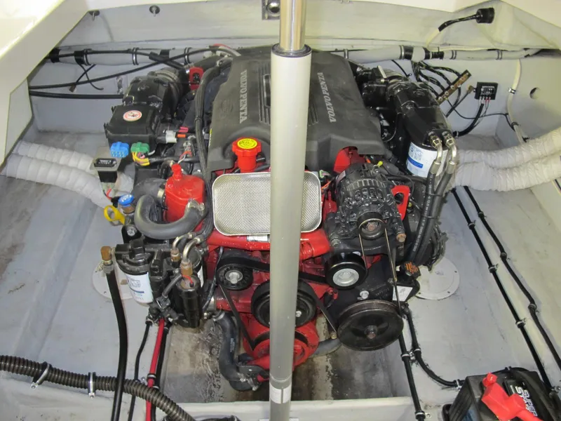 Slide: The Image of 2003 Chris-Craft Launch 28 engine compartment with visible components and wiring. - 9