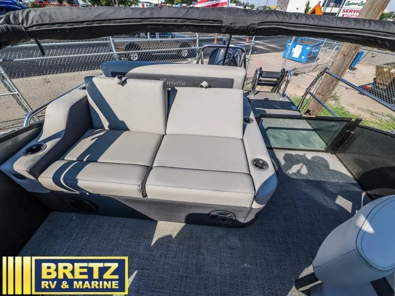 Slide: The Image of 2024 Cabrio Ultra-Entertainer C24UE boat interior with comfortable seating at Bretz RV & Marine. - 12