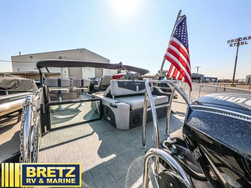 Slide: The Image of 2024 Cabrio Ultra-Entertainer C24UE pontoon boat with American flag at Bretz RV & Marine. - 4
