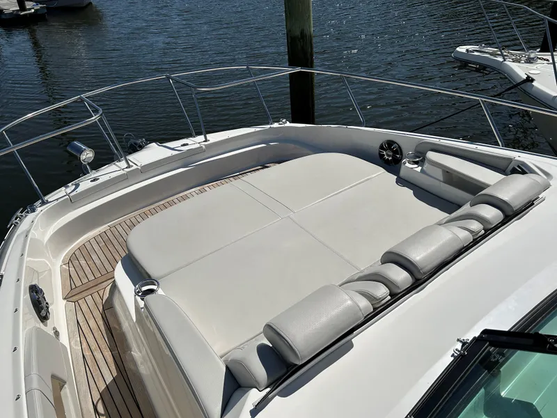 Slide: The Image of 2021 Sea Ray 320 DA boat with spacious sunbathing area and sleek design. - 16