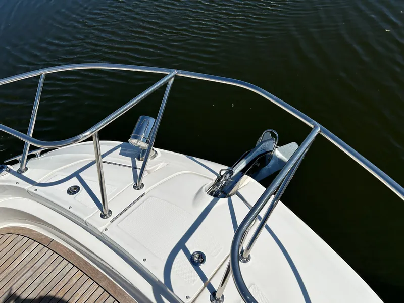 Slide: The Image of Bow of 2021 Sea Ray 320 DA boat with stainless steel railings. - 17