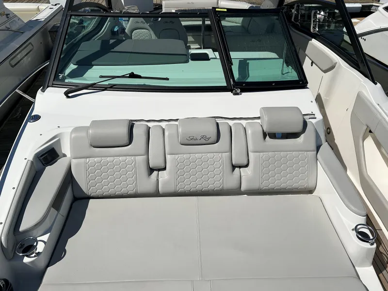 Slide: The Image of 2021 Sea Ray 320 DA boat with luxurious seating and modern design. - 18