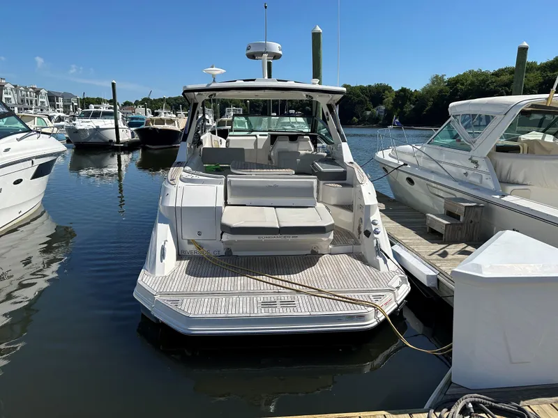 Slide: The Image of 2021 Sea Ray 320 DA yacht docked at marina, rear view. - 3