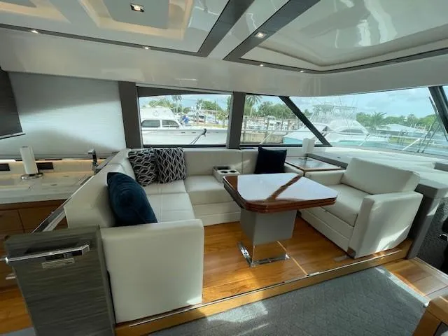 Slide: The Image of Luxurious interior of 2019 Tiara Yachts C53 Coupe with white leather seating and modern design. - 15
