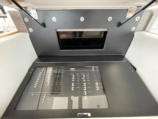 Slide: The Image of 2019 Tiara Yachts C53 Coupe control panel with protective cover open. - 20