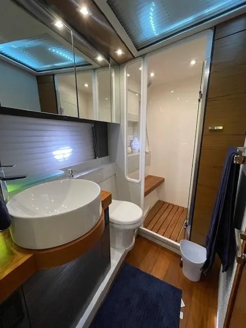 Slide: The Image of Modern bathroom in 2019 Tiara Yachts C53 Coupe with vessel sink and enclosed shower. - 23