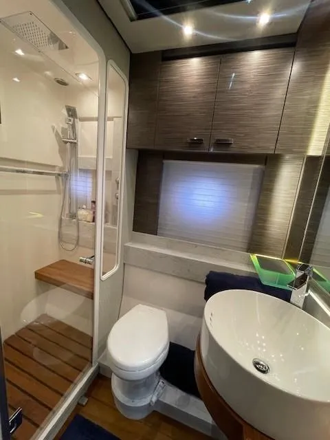 Slide: The Image of 2019 Tiara Yachts C53 Coupe bathroom with modern fixtures and shower. - 27
