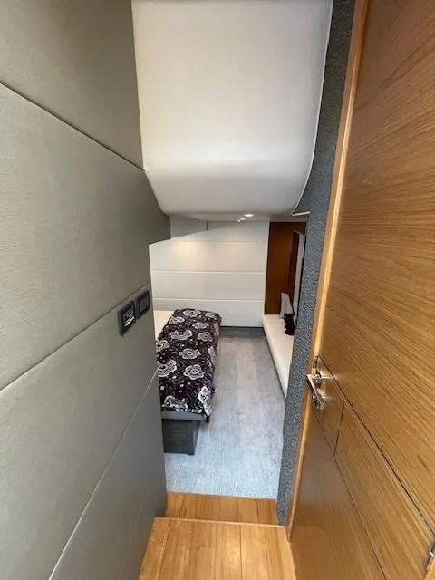 Slide: The Image of 2019 Tiara Yachts C53 Coupe interior cabin with bed and modern design. - 30