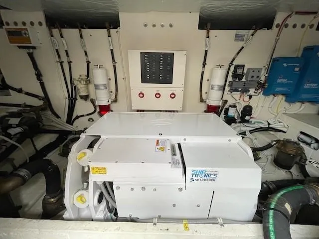 Slide: The Image of Engine room of 2019 Tiara Yachts C53 Coupe with Shiptronics equipment. - 31