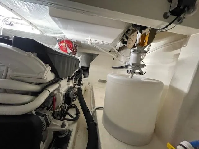 Slide: The Image of Engine room of a 2019 Tiara Yachts C53 Coupe with visible components. - 35