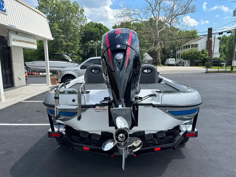 Slide: The Image of 2022 Charger Bass Boat 176 rear view with outboard motor in parking lot. - 4