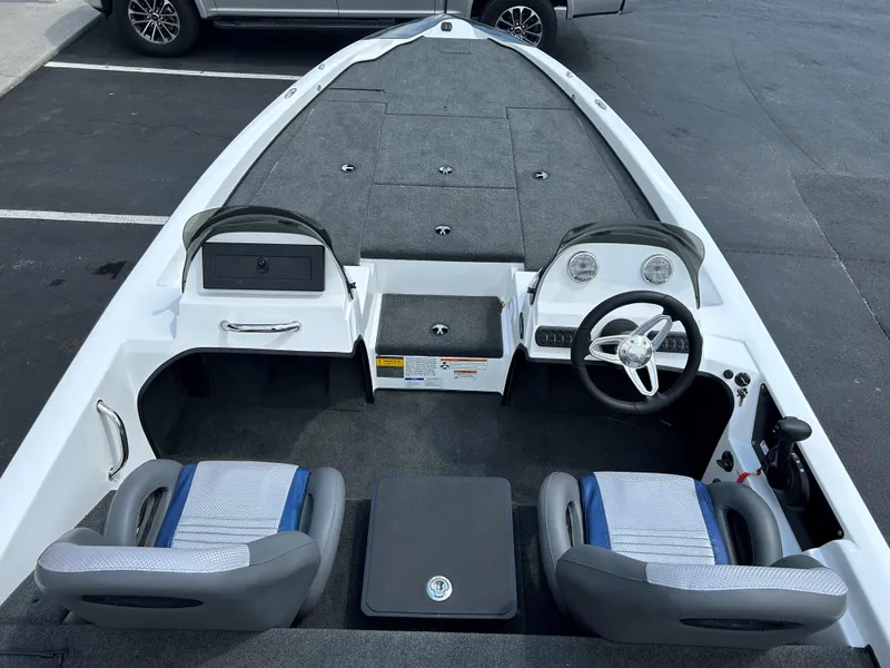 Slide: The Image of 2022 Charger Bass Boat 176 interior with dual seats and steering console. - 5