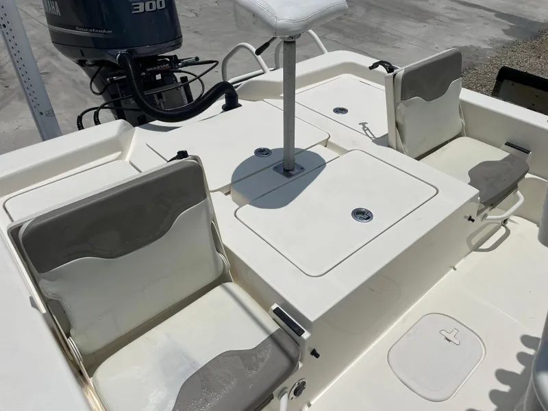 Slide: The Image of 2016 Skeeter SX 240 boat interior with seating and storage compartments. - 5