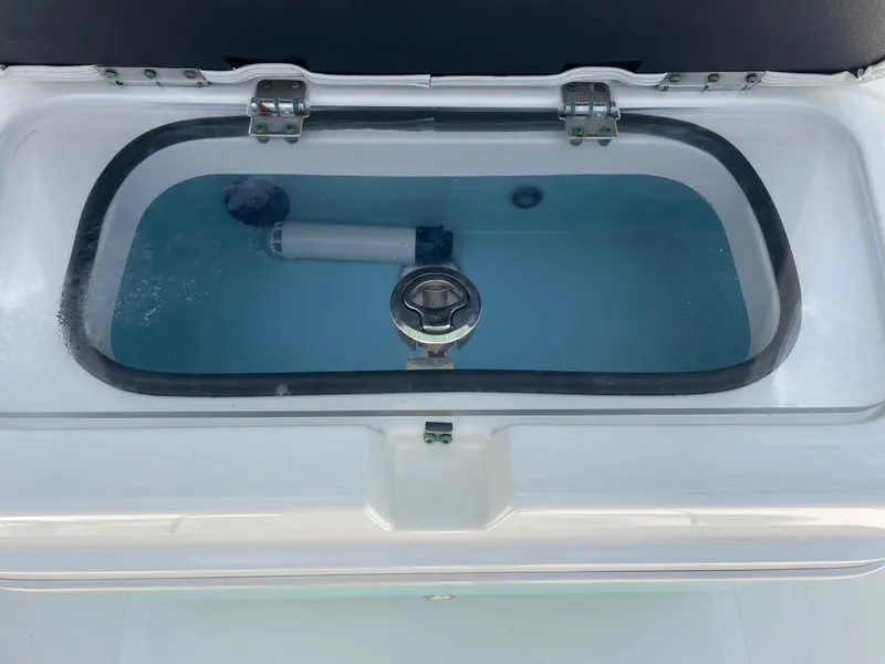 Slide: The Image of Livewell tank on a 2016 Skeeter SX 240 boat filled with water. - 6