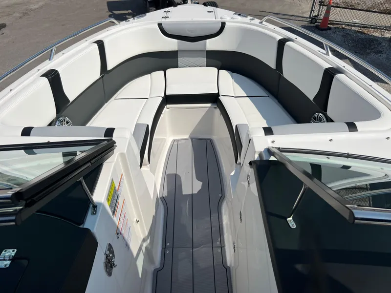 Slide: The Image of 2024 Chaparral 270 OSX boat interior with spacious seating and modern design. - 11