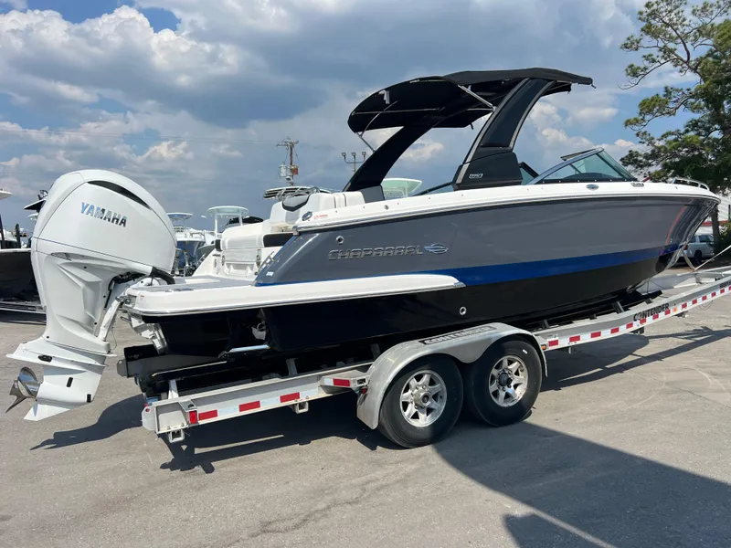 Slide: The Image of 2024 Chaparral 270 OSX boat on a trailer with Yamaha outboard motor. - 2