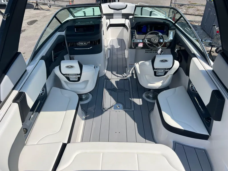 Slide: The Image of 2024 Chaparral 270 OSX boat interior with modern seating and dashboard. - 7