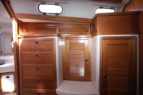 Slide: The Image of Interior of 2002 Catalina 42 MK 2 sailboat with wooden cabinets and drawers. - 18