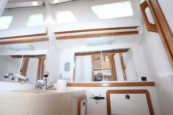 Slide: The Image of Interior of 2002 Catalina 42 MK 2 yacht bathroom with sink and mirror. - 24