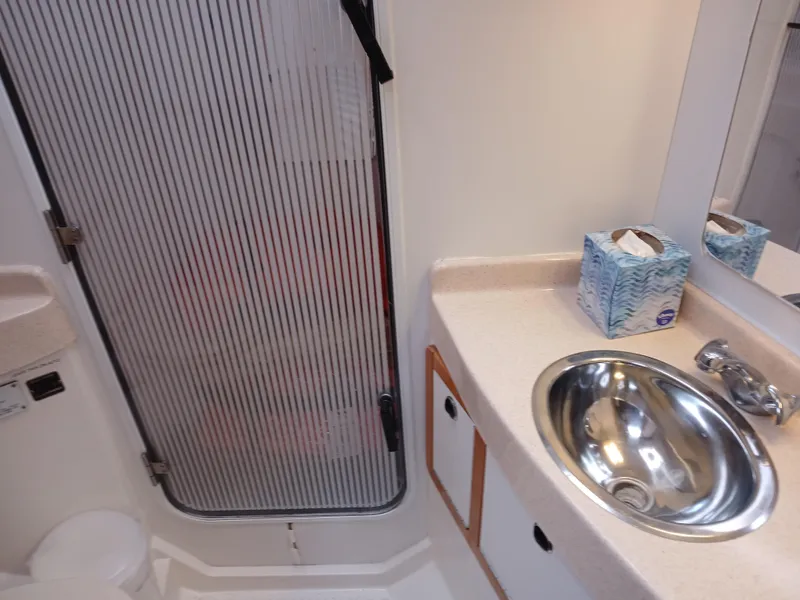 Slide: The Image of Bathroom of 2002 Catalina 42 MK 2 sailboat with sink, mirror, and shower door. - 26