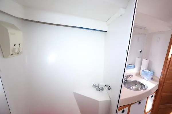 Slide: The Image of 2002 Catalina 42 MK 2 yacht bathroom with sink and mirror. - 27