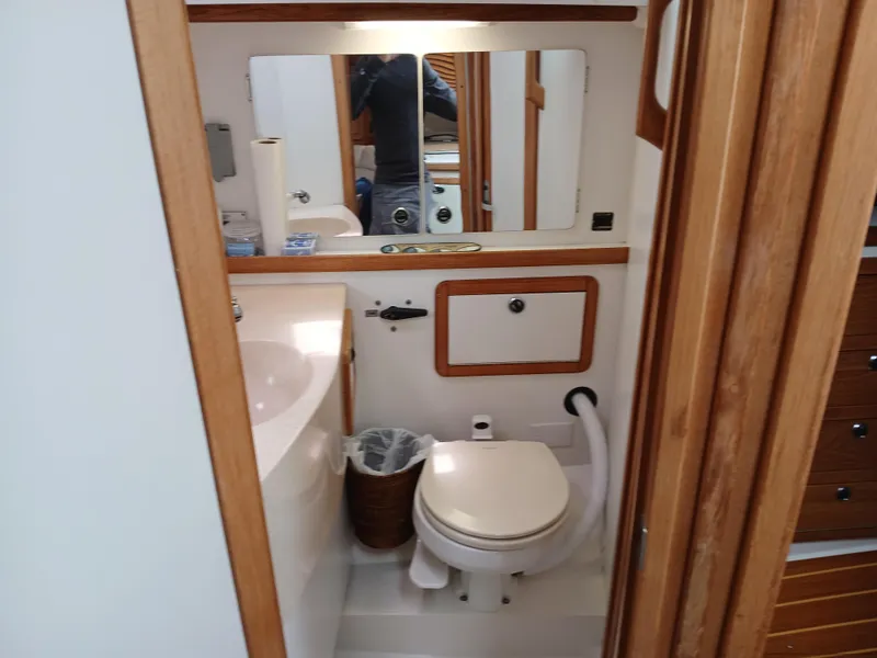Slide: The Image of 2002 Catalina 42 MK 2 sailboat bathroom with sink, toilet, and mirror. - 30