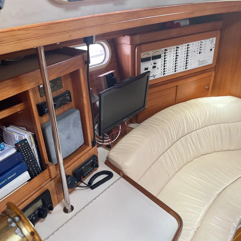 Slide: The Image of Interior of 2002 Catalina 42 MK 2 yacht with navigation equipment and white leather seating. - 33