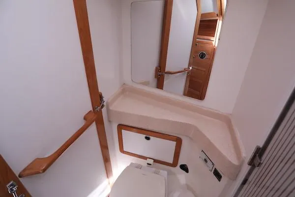 Slide: The Image of 2002 Catalina 42 MK 2 yacht bathroom with wooden accents and compact design. - 35