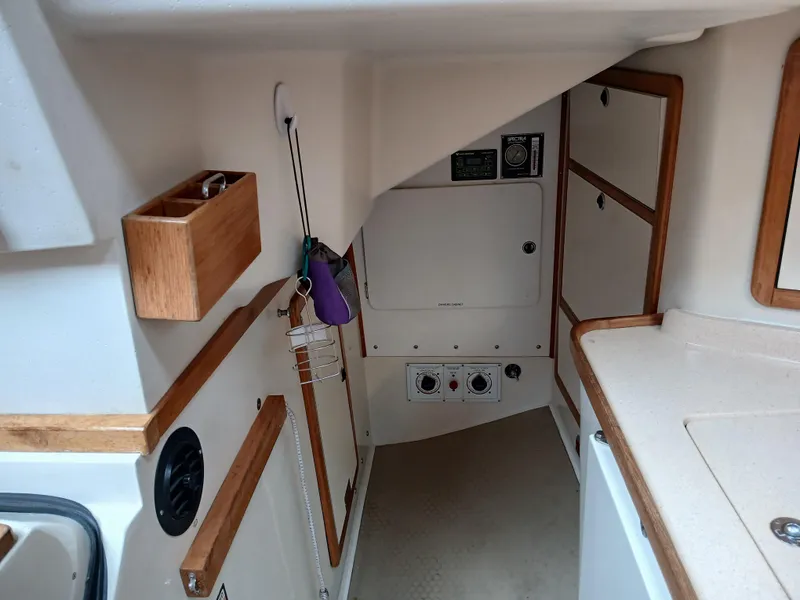 Slide: The Image of Interior of 2002 Catalina 42 MK 2 sailboat with wooden accents and storage compartments. - 40