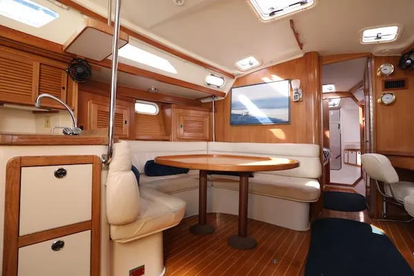 Slide: The Image of Interior of 2002 Catalina 42 MK 2 sailboat with wooden finishes and cozy seating area. - 41