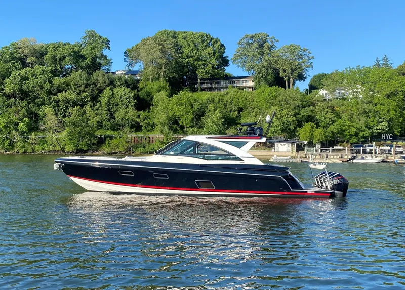 Slide: The Image of 2021 Formula 430 Super Sport Crossover boat on a scenic river. - 1