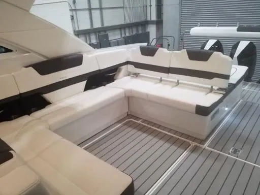 Slide: The Image of 2021 Formula 430 Super Sport Crossover interior seating area in a modern boat. - 13