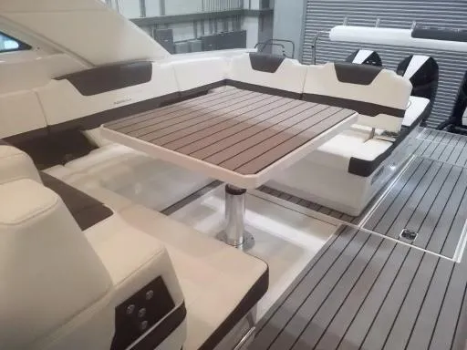 Slide: The Image of 2021 Formula 430 Super Sport Crossover yacht with luxurious seating and dining area. - 14