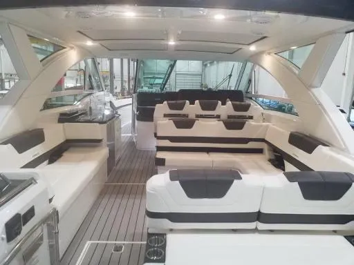 Slide: The Image of 2021 Formula 430 Super Sport Crossover yacht interior with luxurious seating and modern design. - 15