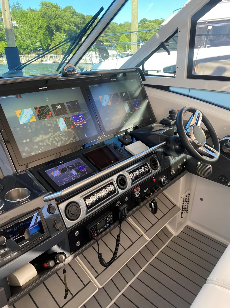 Slide: The Image of 2021 Formula 430 Super Sport Crossover helm with advanced navigation systems and controls. - 17