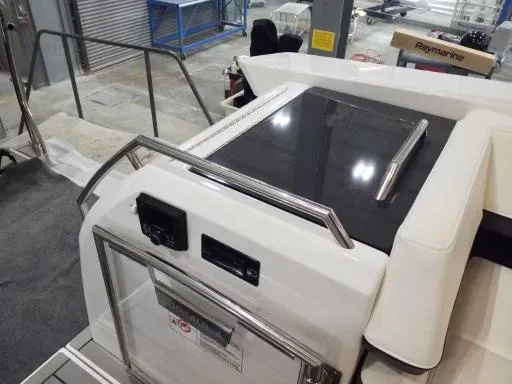 Slide: The Image of 2021 Formula 430 Super Sport Crossover boat interior with control panel and seating. - 8