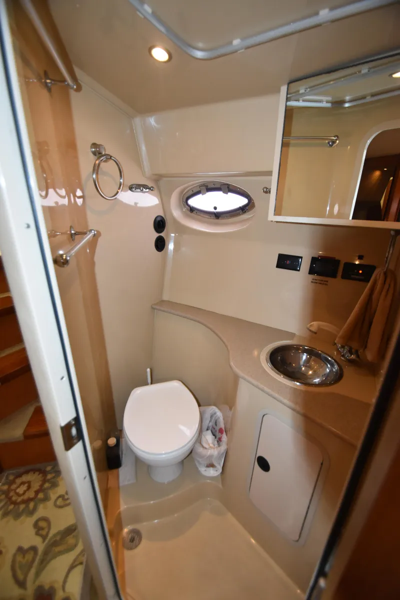 Slide: The Image of 2004 Cruisers Yachts 320 Express bathroom with toilet and sink. - 11