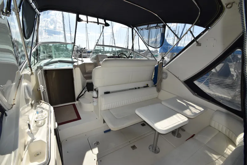 Slide: The Image of Interior of a 2004 Cruisers Yachts 320 Express with seating area. - 13